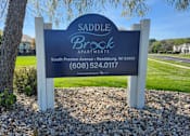Thumbnail 2 of 21 - A sign for Saddle Brook Apartments in Reedsburg, WI.