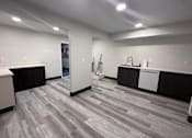Thumbnail 14 of 19 - A room with a grey floor and white walls.