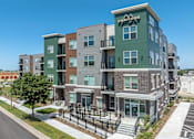 Thumbnail 1 of 54 - A modern apartment complex named Canyons is shown in the image.