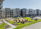 Thumbnail 2 of 80 - Apartment complex with a playground in the front.