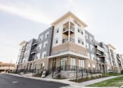 Thumbnail 1 of 39 - a new apartment building with balconies and a sidewalk