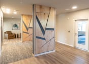 Thumbnail 15 of 39 - an open living room with a sliding barn door