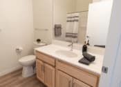 Thumbnail 11 of 39 - an empty bathroom with a sink and a toilet