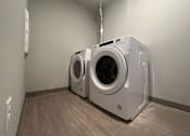 Thumbnail 7 of 13 - a washer and dryer in a laundry room