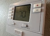 Thumbnail 8 of 13 - a digital thermostat on a wall