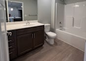 Thumbnail 6 of 13 - a bathroom with a toilet sink and bathtub