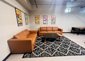 Thumbnail 9 of 13 - a living room with couches and a coffee table