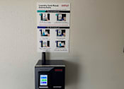 Thumbnail 23 of 36 - A WASH machine with instructions on how to use the card kiosk.