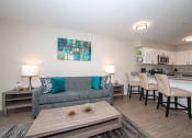 Thumbnail 7 of 16 - Spacious living room with granite bar countertop