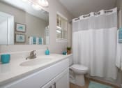Thumbnail 11 of 16 - Newly remodeled bathroom with cultured marble top white vanity with storage