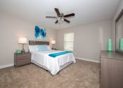Thumbnail 9 of 16 - Large bedroom with ceiling fan that is big enough for a king size bed