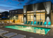 Thumbnail 19 of 27 - Evening Pool with Pool Lights at The Gallery Midtown Apartments in Richmond, VA