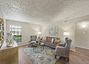 Thumbnail 3 of 38 - Spacious living room with vaulted ceiling at Parks on the Green Apartments, Texas, 76504