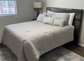 Thumbnail 10 of 11 - Bedroom with Cozy bed at Jackson Way Apartments, Texas