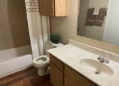 Thumbnail 18 of 22 - a bathroom with a sink and a toilet and a bath tub  at Summit Ridge Apartments, Temple, Texas
