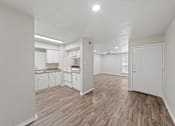 Thumbnail 6 of 38 - Open concept living and dining area with kitchen at Parks on the Green Apartments, Temple