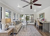 Thumbnail 12 of 38 - Open concept living and dining space with bar seating at Parks on the Green Apartments, Texas