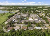 Thumbnail 13 of 38 - Aerial view of apartment community with pool and parking at Parks on the Green Apartments, Texas, 76504