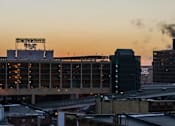 Thumbnail 9 of 14 - a city skyline with a large building in the middle