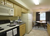 Thumbnail 6 of 21 - Kitchen with eat-in dining  table and window