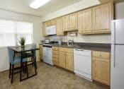 Thumbnail 5 of 11 - Bright eat in kitchen with extra storage at Kingston Townhomes, Baltimore, MD