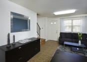 Thumbnail 4 of 11 - Large living room with lots of natural light at Kingston Townhomes, Baltimore, 21220