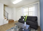 Thumbnail 2 of 11 - Large living room with lots of natural light  at Kingston Townhomes, Baltimore, 21220