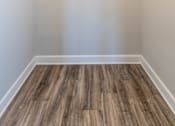 Thumbnail 14 of 25 - A closet with white walls and wood floors at McDonogh Village Apartments & Townhomes, Randallstown, MD