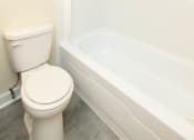 Thumbnail 21 of 33 - Bathroom with a toilet and a bathtub at Seminary Roundtop Apartments, Lutherville, MD