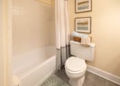 Thumbnail 14 of 28 - Bathroom with a toilet and a tub at Ivy Hall Apartments*, Towson, MD 21204