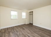 Thumbnail 18 of 23 - Bedroom with hardwood floors and white walls at The Orchards at Severn Townhomes*, Severn