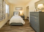 Thumbnail 11 of 32 - Bedroom with a bed and dresser in a 555 waverly unit at Seven Oaks Townhomes, Edgewood