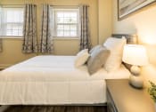 Thumbnail 12 of 32 - Bedroom with a bed and two windows at Seven Oaks Townhomes, Edgewoode, MD, 21040