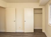 Thumbnail 6 of 16 - Two white doors in a room with wood flooring at Lawyers Hill Apartments, Elkridge, 21075