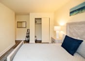 Thumbnail 12 of 23 - Bedroom with a large bed and a closet at Rockdale Gardens Apartments*, Baltimore, MD