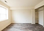 Thumbnail 18 of 25 - a bedroom with a closet and a window  at Charlesgate Apartments, Towson, Maryland