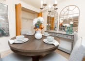 Thumbnail 12 of 31 - Spacious and bright dining room with storage at Spring Hill Apartments & Townhomes, Baltimore, MD