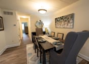 Thumbnail 5 of 28 - Dining room with a wooden table and chairs at Ivy Hall Apartments*, Towson