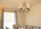 Thumbnail 3 of 36 - Dining room with window , hanging light fixture, and dining room table