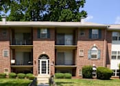 Thumbnail 17 of 17 - A red brick apartment building at Woodridge Apartments, Randallstown, 21133