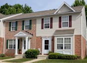 Thumbnail 22 of 22 - Exterior view of front of townhomes at Carlson Woods Townhomes, Baltimore, MD, 21244