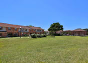 Thumbnail 21 of 21 - Property Exterior Lawn at Chapel Valley Townhomes, Baltimore, MD
