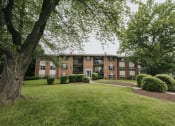 Thumbnail 1 of 29 - Exterior of building with plush landscape and greenery in Randallstown, MD 21133.