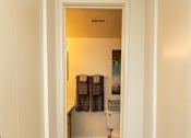 Thumbnail 9 of 27 - A bathroom with a toilet, sink, and towel rack.at Deer Park Apartments, Randallstown