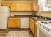Thumbnail 10 of 32 - Kitchen with white appliances at Seven Oaks Townhomes, Edgewood, MD