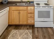 Thumbnail 9 of 32 - Kitchen with wooden cabinets at Seven Oaks Townhomes, Edgewood, Maryland