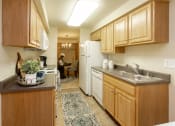 Thumbnail 6 of 31 - Large kitchen with plenty of storage at Spring Hill Apartments & Townhomes, Baltimore, 21234