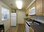 Thumbnail 4 of 10 - Kitchen With Granite Counter Top at Colony Hill Apartments & Townhomes, Baltimore, Maryland