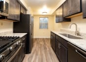 Thumbnail 3 of 33 - Kitchen with Black appliance at Seminary Roundtop Apartments, Lutherville, Maryland, 21093