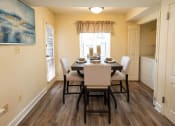 Thumbnail 4 of 28 - View of a dining room with a table and chairs at Ivy Hall Apartments*, Towson, MD
